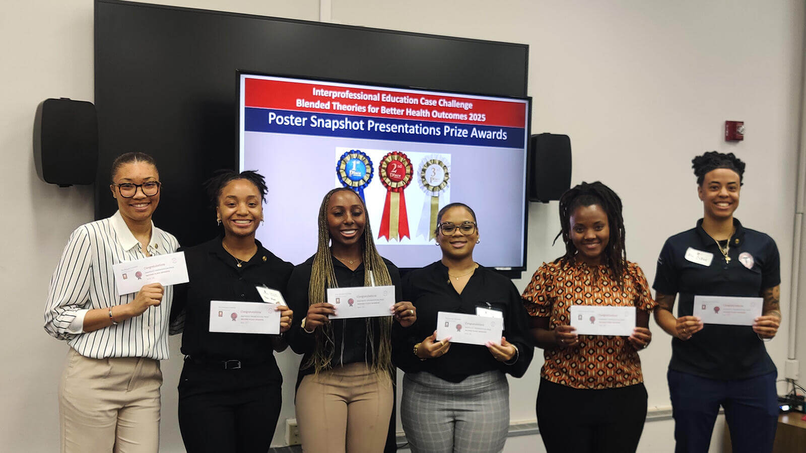 Research awardees holding prize